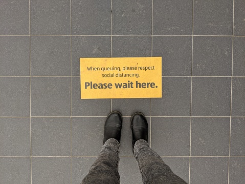 Scarborough, UK. May 10 2020. During lock-down shops used signage to advise where to stand to queue to abide by the 2 metre rule