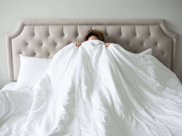 istock hand hold blanket on bed feeling scare frighten nightmare 1250422500