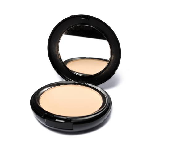 istock Cosmetic foundation cream and powder with mirror isolated on white background 1250425083