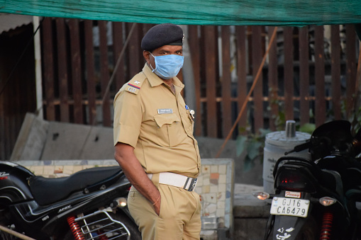 Bharuch, Gujarat / India - April 05 2020: Covid 19 Corona Virus unlock in India. Police on duty to stop people from roaming in city unnecessary and to prevent spread of Corona. Corona warriors.