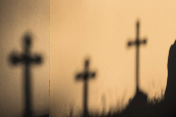 istock Shadows of crosses on the wall. 1250427802