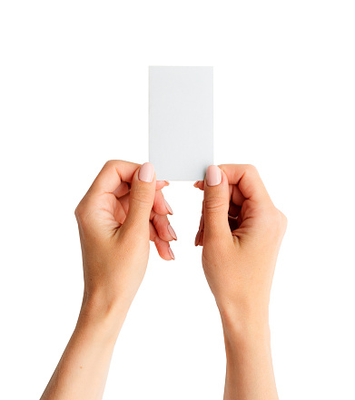 Woman holding white business card in hands isolated on a white background. Tamplate for your design.