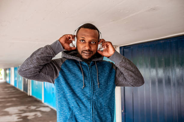istock Young adult man with headphones 1250431925