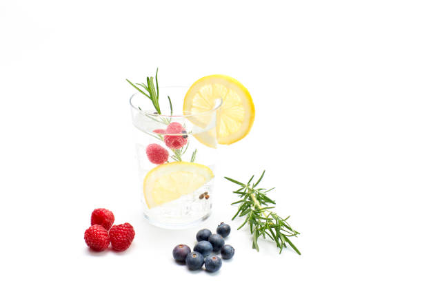 tonic drink with lemon and fruits. white background, studio shot - vitality food food and drink berry fruit imagens e fotografias de stock