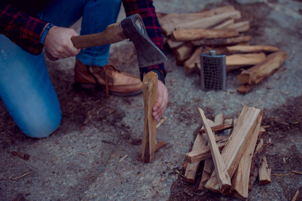 istock man chopping wood for a fire 1250436454