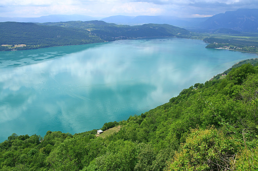 It's a view of the Bourget lake in Savoy. With an area of 44 km2 is the largest natural lake of glacial orogin in France. The west bank is uninhabited, wild and inaccessible by land. On the east bank is the spa town of Aix-Les-Bains. Many beaches are provided, leisure centers and many tourist sites.