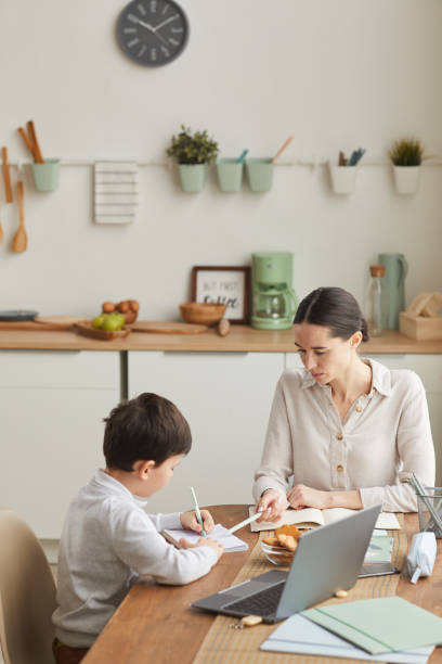 istock Mother and Son Studying at Home 1250438513