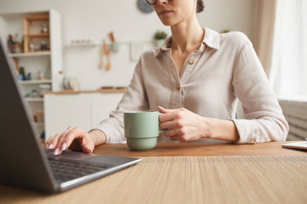 istock Young Woman Working at Kitchen Table Close Up 1250438593