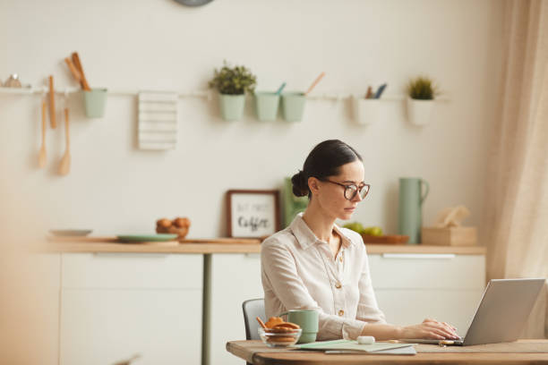 istock Elegant Woman Working at Home 1250438596