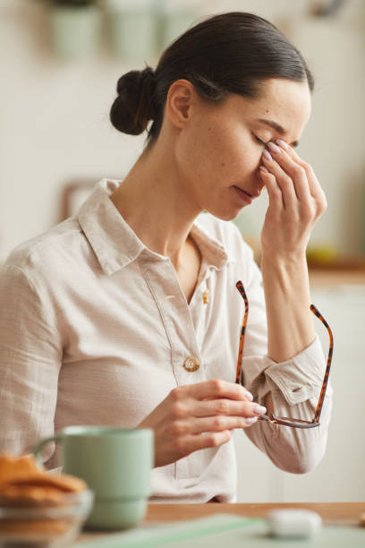 istock Stressed Young Woman Taking off Glasses 1250438639