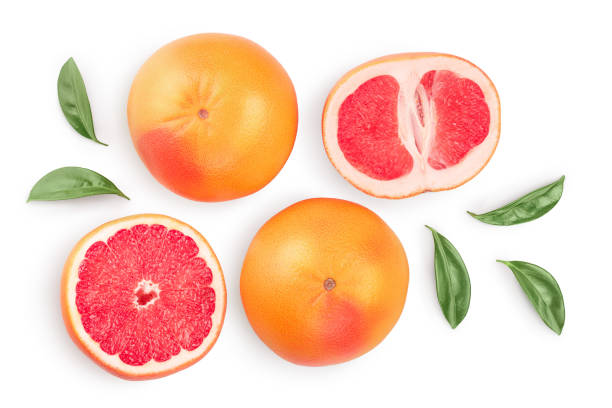 istock Grapefruit and slices with leaves isolated on white background. Top view. Flat lay. With clipping path and full depth of field 1250440606