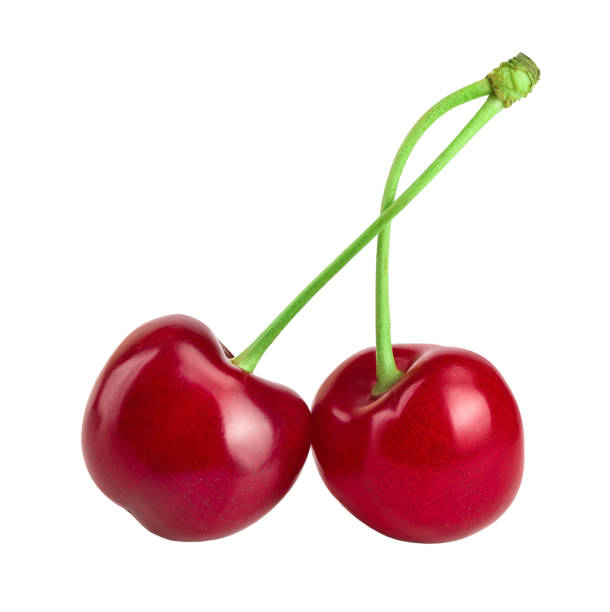 istock Two cherries with leaf closeup isolated on white background 1250443375