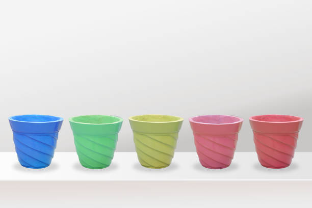 istock empty flower pots of different colour and different prospective, isolated on white background, copy space. 1250443792