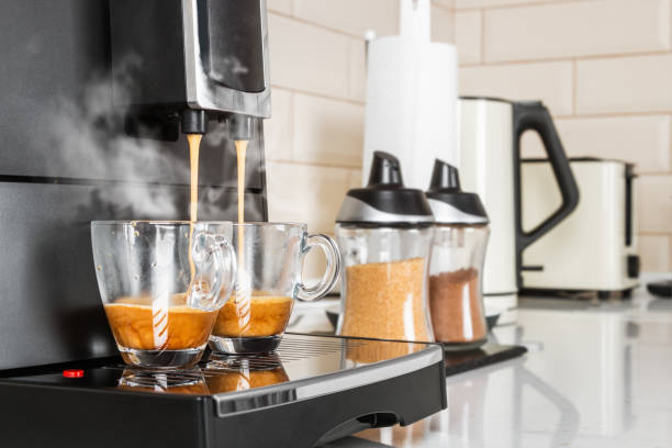 istock coffee from the coffee machine is poured into glass cups 1250444028