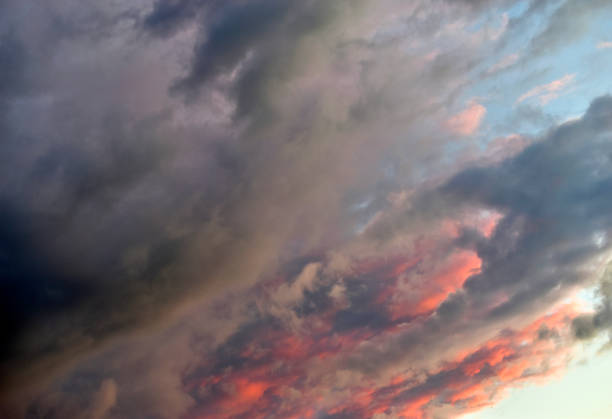 istock Evening sky and clouds tinged with multicolored rays of the sun 1250444217