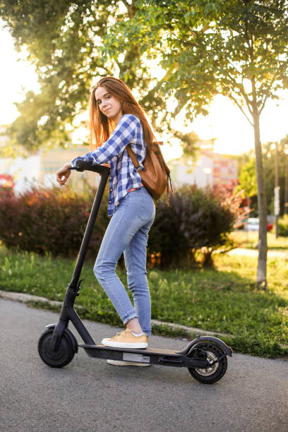 istock Young woman driving an electric scooter 1250448637