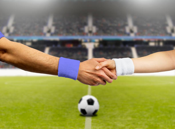 istock soccer player doing handshake at soccer stadium 1250449669