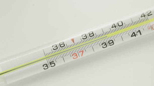 istock Glass mercurial thermometer. 39.1 degree on the table 1250450769