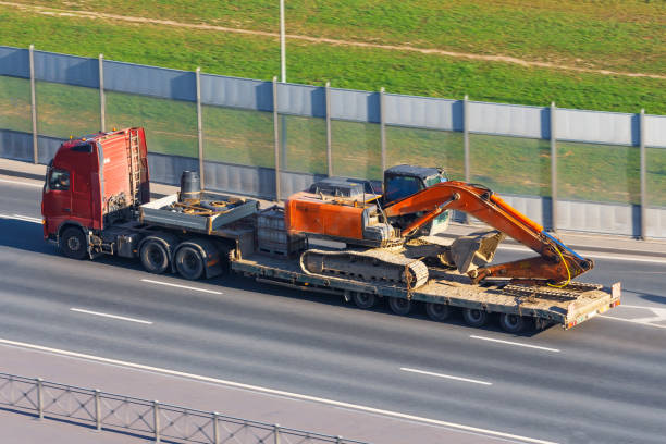 large truck transporting bulldozer