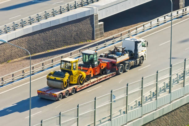 istock Carriage on a trailer platform of two paver rollers. 1250455894