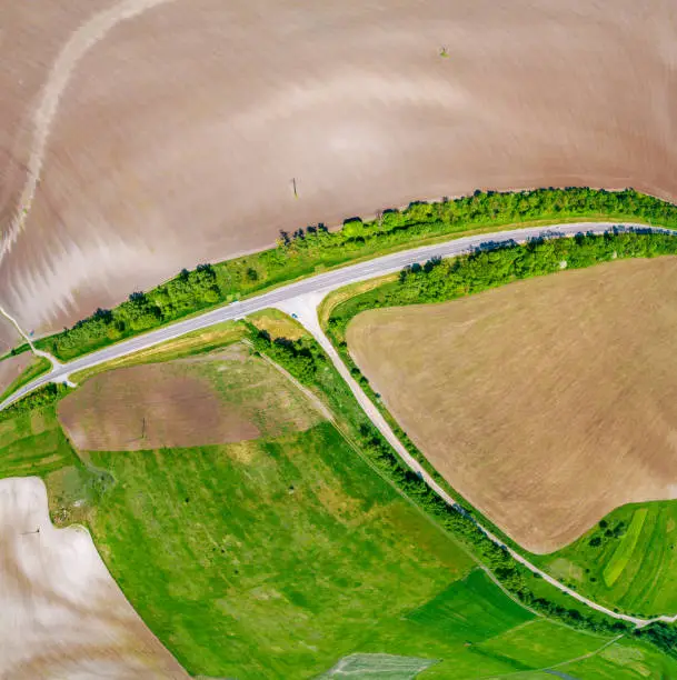 Rural landscape. Aerial view, Skyview of the countryside. View of plowed and green fields in spring. Panorama from 9 images