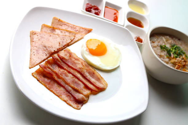 istock Rice Porridge, ham, bacon, fried egg, served with various sauces 1250458051