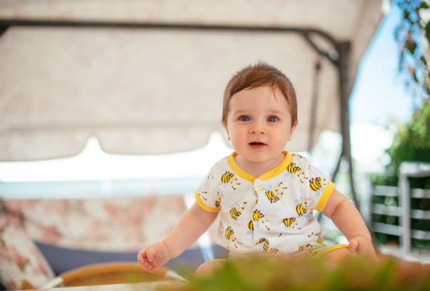 istock Happy Baby Sitting on the Balcony 1250458998