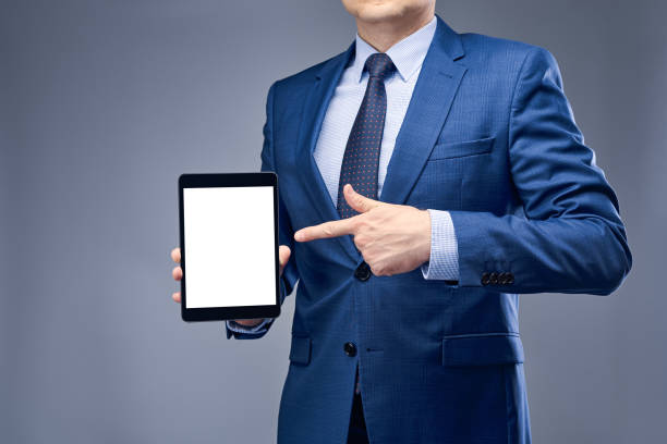 istock Businessman in a blue suit on a gray-blue background 1250461638