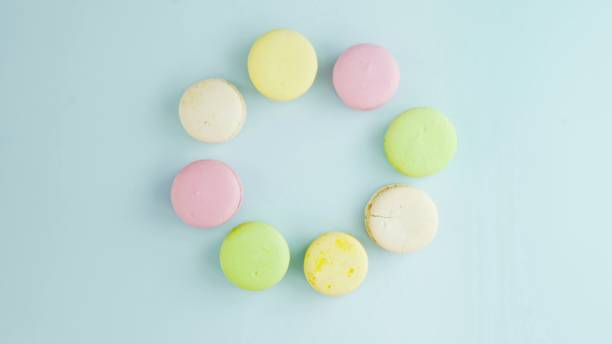 Three Macaroons or macaron on pastel blue surface