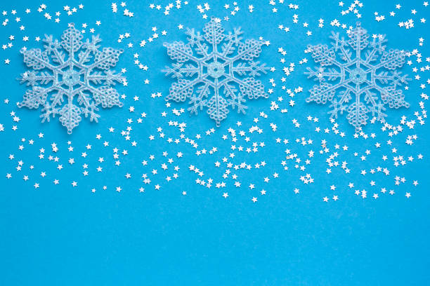 istock Winter blue frame background with snowflakes 1250466858