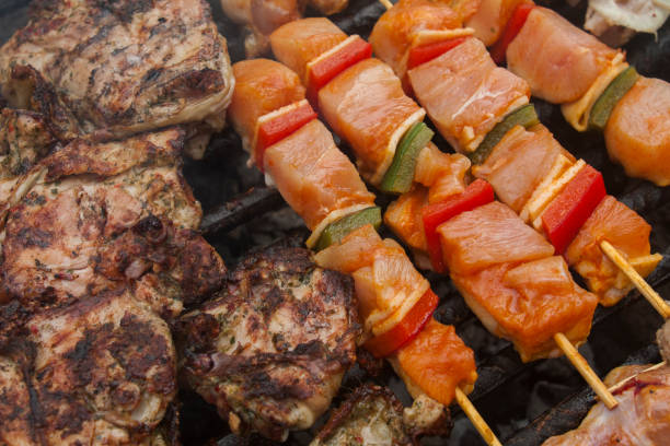 istock BBQ marinaded meat beef pork with vegetables on grill 1250467056