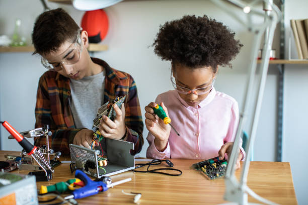 istock Future engineers finishing science project together at home 1250468465