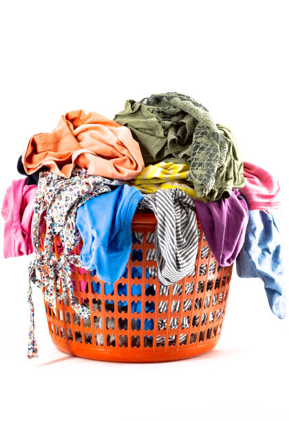 istock Laundry basket full of colorful clothes 1250468590
