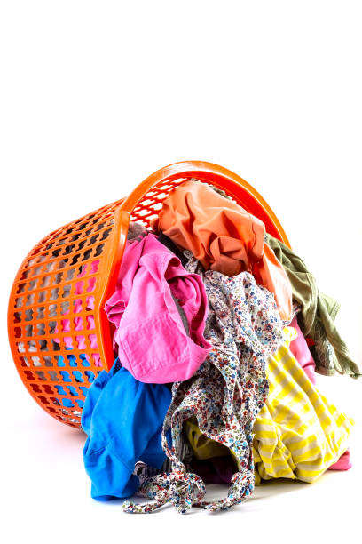 istock Laundry basket full of colorful clothes 1250469776