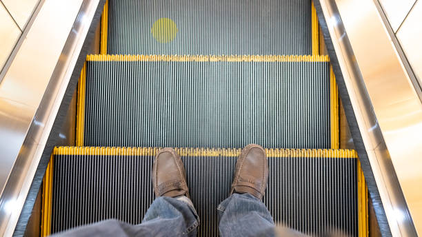 istock The man standing on the escalator in the Sar Singha mall 1250469874