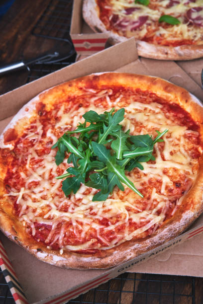 istock Pizza Margarita with Arugula in a Take Away Box 1250469968