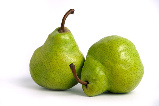 Two green Packham pears fruit isolated on white background. Image Photo