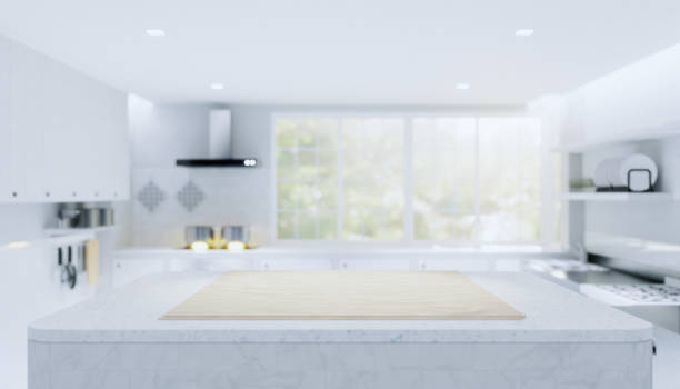 istock Wood countertop product display and blurred kitchen background. 1250471080