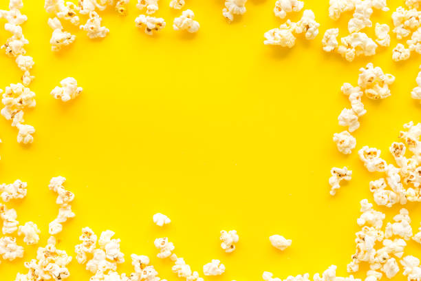 istock Popcorn mockup on yellow background top view copy space 1250471261