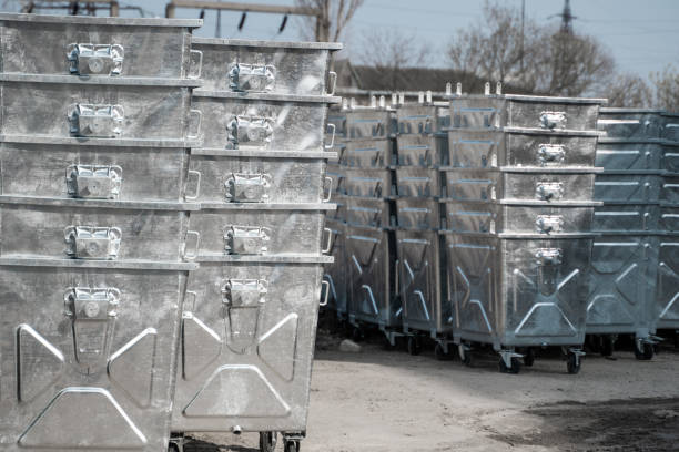 istock Warehouse of a new silver garbage containers. 1250472396