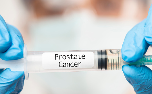 Doctor showing Prostate Cancer Vaccine.