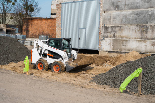 istock White skid steer loader at a construction site working with a soil. Industrial machinery. Industry. 1250472993