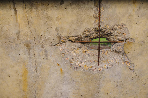 istock A hole in an old dirty concrete surface. Rusty fittings visible. background texture. Horizontal 1250474155