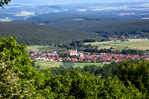 panoramic view of green valley with small village in bavaria