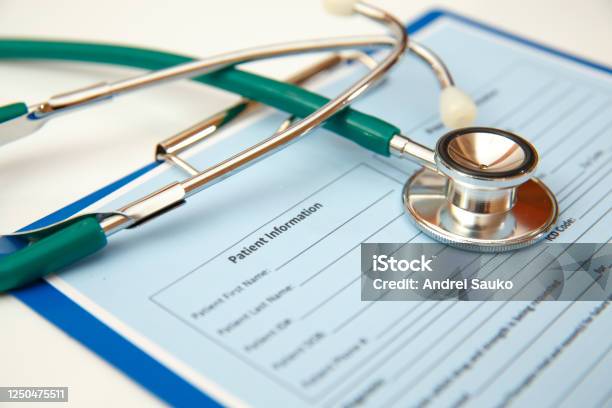 Stethoscope And Patient Appointment Form Stock Photo - Download Image Now - Advice, Biology, Bottle