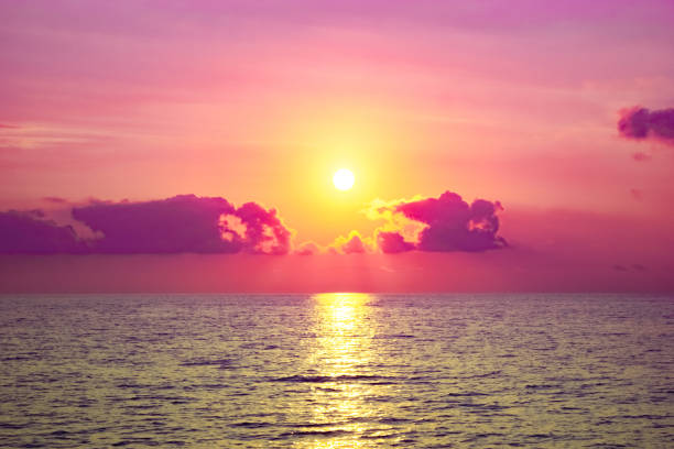 istock Sunset at sea. The sun is hiding behind the clouds. 1250479998
