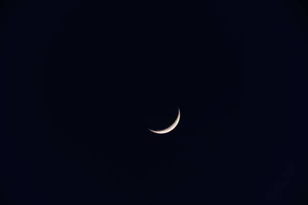 istock Young Moon and Venus on a dark night sky. 1250480044