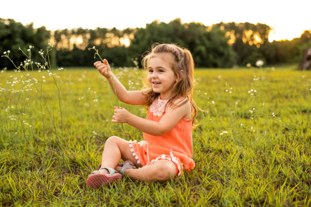 istock Girl playing in a meadow 1250483604