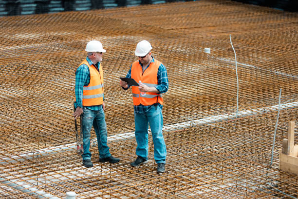istock Managers, engineers discuss the further process of work on the construction site 1250483616