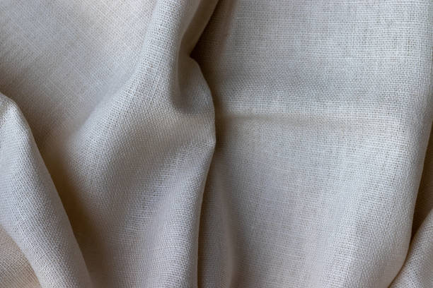 istock Natural linen fabric texture. Rough crumpled burlap background. Selective focus. Closeup view 1250483979